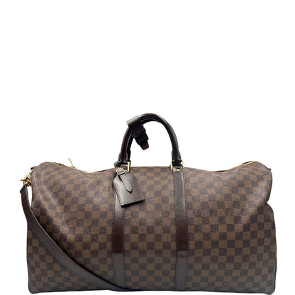 front Borsone Louis Vuitton in canvas Damier Ébène marrone con finiture in pelle tono su tono e parti metalliche dorate; munito di doppi manici stondati e una tracolla amovibile e regolabile. Completo di lucchetto, chiavi e dustbag, di lusso, originale, ottime condizioni, usato. 