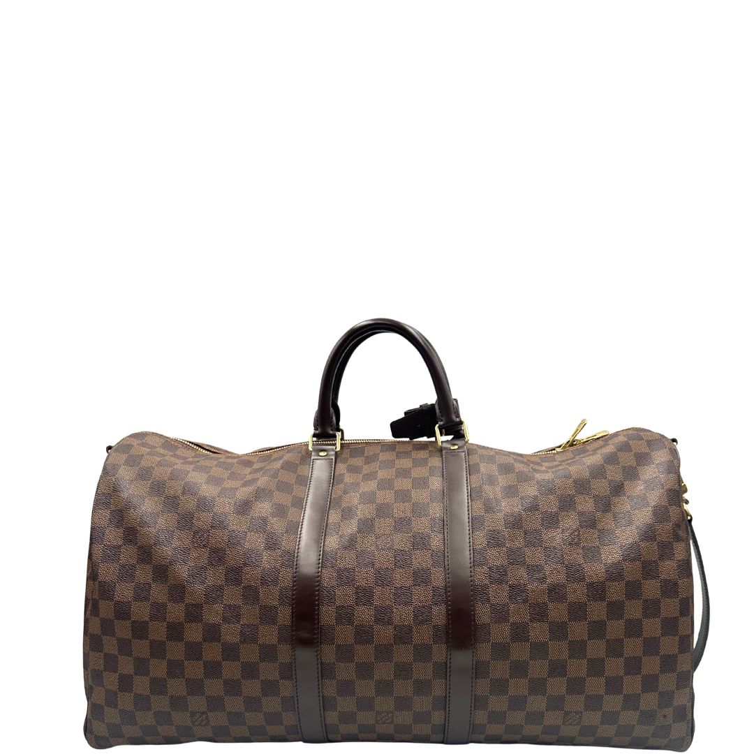 retro Borsone Louis Vuitton in canvas Damier Ébène marrone con finiture in pelle tono su tono e parti metalliche dorate; munito di doppi manici stondati e una tracolla amovibile e regolabile. Completo di lucchetto, chiavi e dustbag, di lusso, originale, ottime condizioni, usato.
