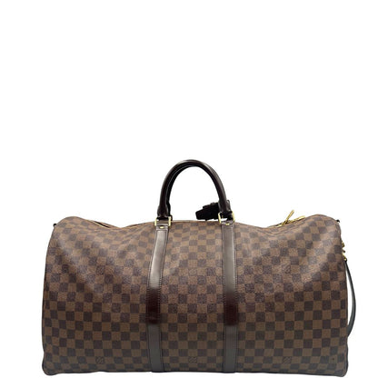 retro Borsone Louis Vuitton in canvas Damier Ébène marrone con finiture in pelle tono su tono e parti metalliche dorate; munito di doppi manici stondati e una tracolla amovibile e regolabile. Completo di lucchetto, chiavi e dustbag, di lusso, originale, ottime condizioni, usato.