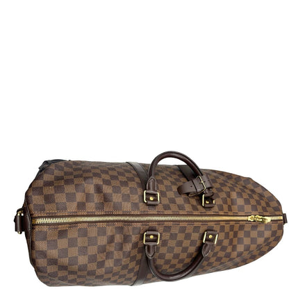 chiusura Borsone Louis Vuitton in canvas Damier Ébène marrone con finiture in pelle tono su tono e parti metalliche dorate; munito di doppi manici stondati e una tracolla amovibile e regolabile. Completo di lucchetto, chiavi e dustbag, di lusso, originale, ottime condizioni, usato. 