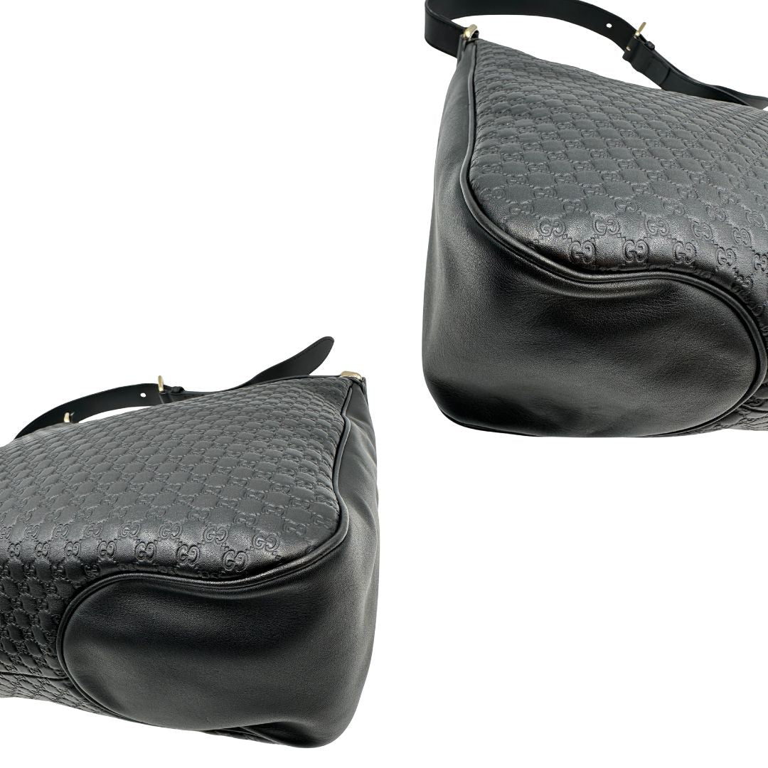 angoli Borsa Gucci in pelle nera GG con parti metalliche dorate; munita di una tracolla regolabile, di lusso, originale, ottime condizioni, usata. 