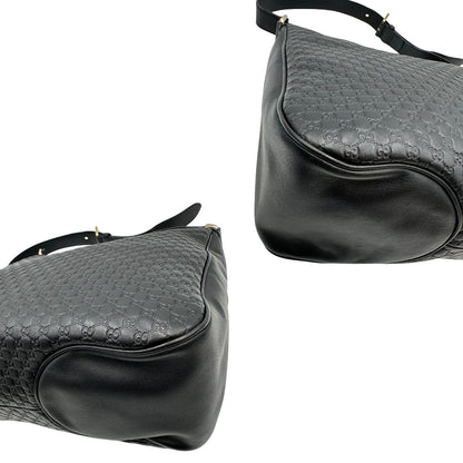 angoli Borsa Gucci in pelle nera GG con parti metalliche dorate; munita di una tracolla regolabile, di lusso, originale, ottime condizioni, usata. 