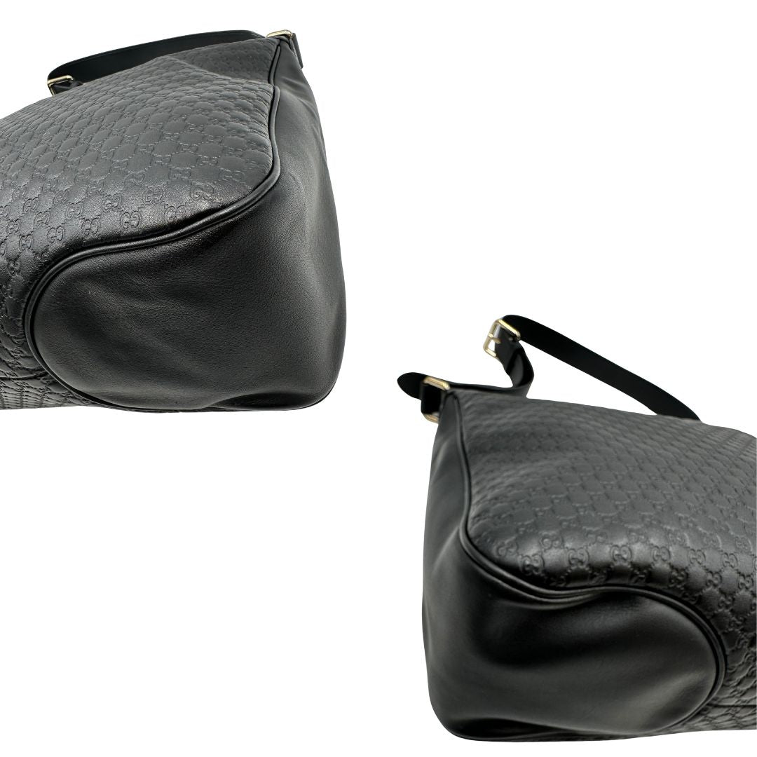 angoli Borsa Gucci in pelle nera GG con parti metalliche dorate; munita di una tracolla regolabile, di lusso, originale, ottime condizioni, usata. 