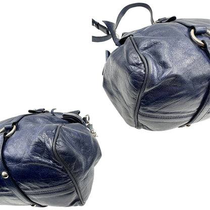 angoli Borsa Miu Miu in pelle blu con parti metalliche argentate; munita di doppi manici e una tracolla amovibile. Completa di dustbag, di lusso, originale, ottime condizioni, usata, originale. 