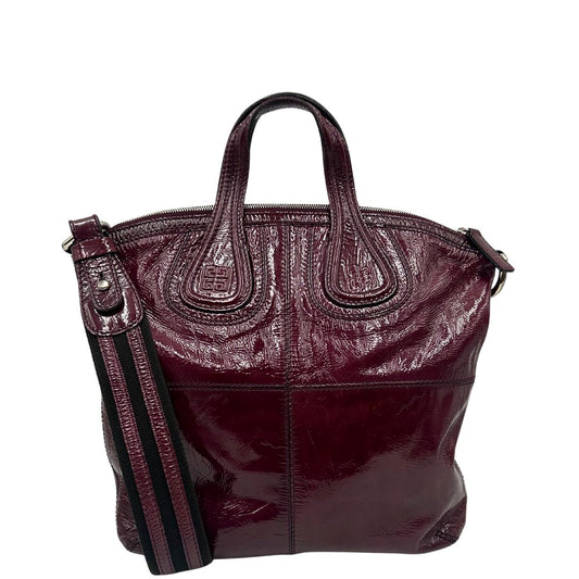 front  Borsa Givenchy in pelle lucida bordeaux effetto invecchiato con parti metalliche argentate; munita di doppi manici e un manico singolo in tessuto e pelle, di lusso, originale, ottime condizioni, usata. 