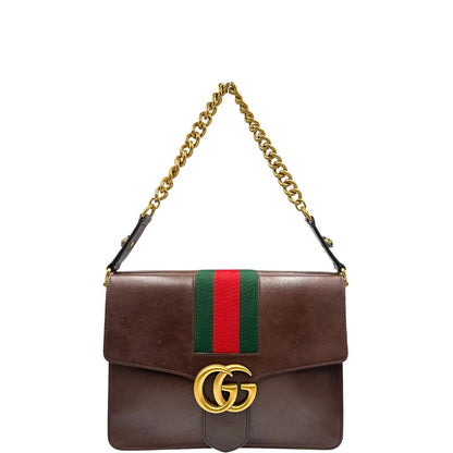 front  Borsa Gucci in pelle marrone con parti metalliche dorate, impreziosita da striscia Web verde e rossa. Munita di un manico singolo in catena e pelle, indossabile a spalla, di lusso, originale, ottime condizioni. 