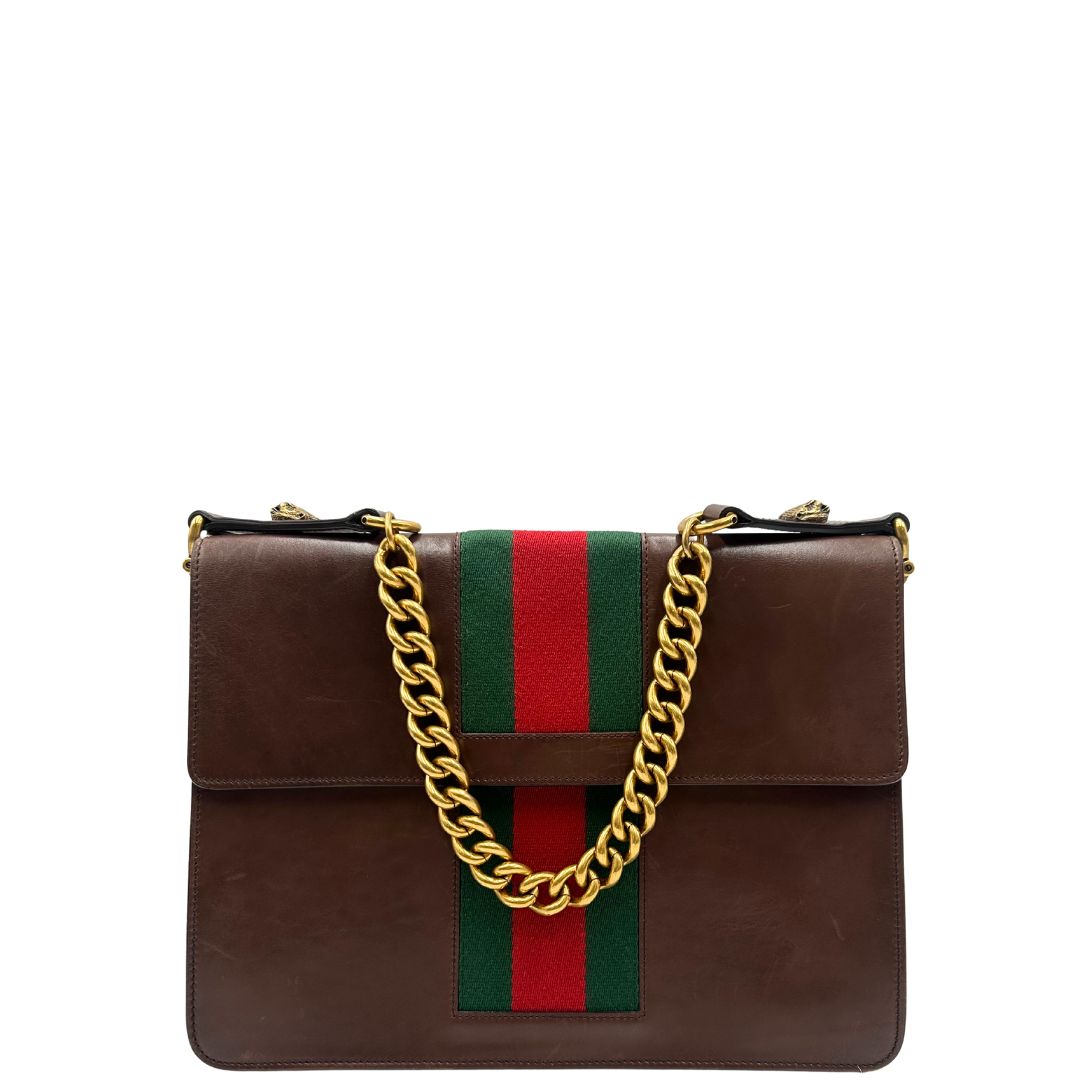 retro  Borsa Gucci in pelle marrone con parti metalliche dorate, impreziosita da striscia Web verde e rossa. Munita di un manico singolo in catena e pelle, indossabile a spalla, di lusso, originale, ottime condizioni. 