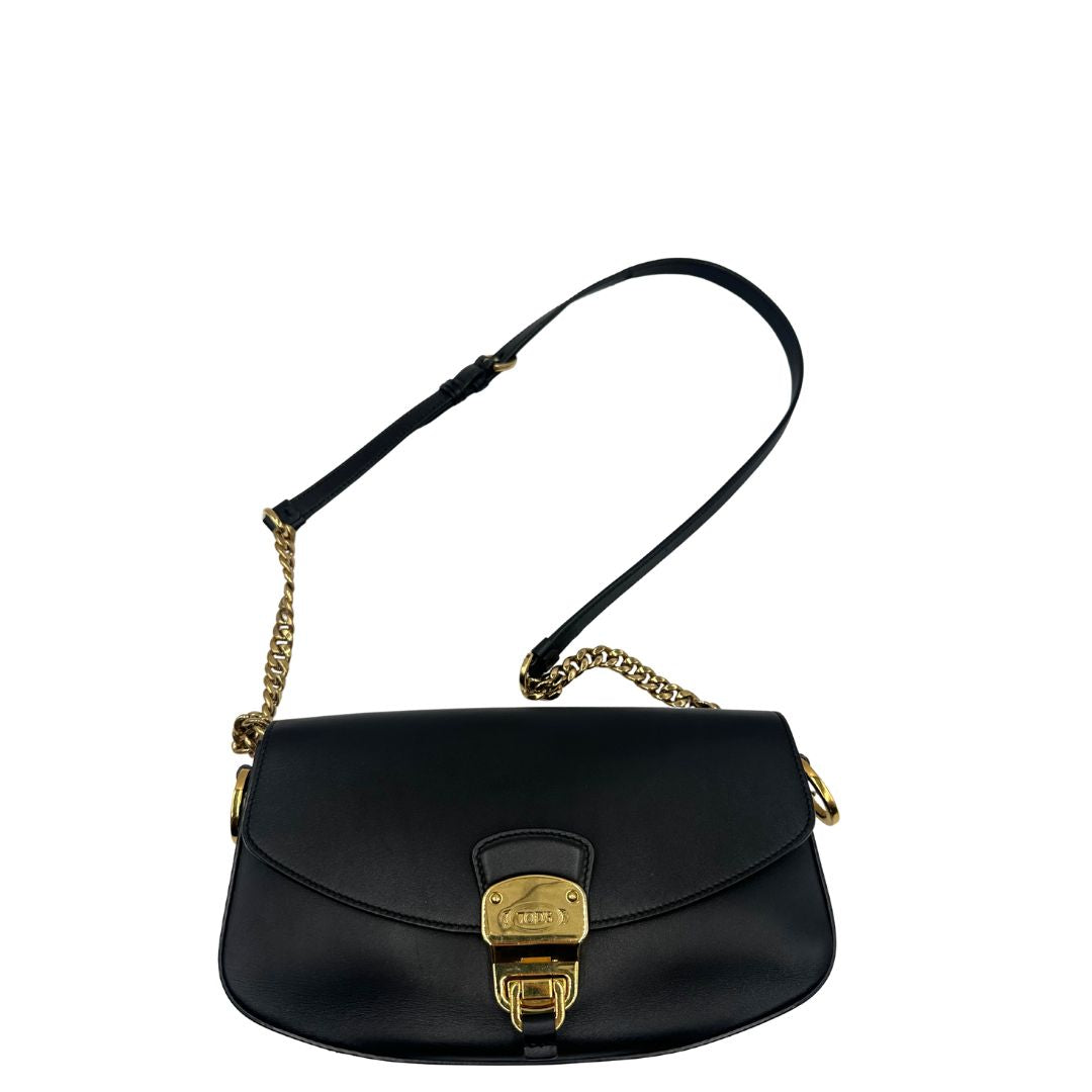 Borsa Tod's in pelle nera con parti metalliche dorate; munita di una tracolla in catena e in pelle non amovibile e regolabile. Completa di dustbag. Originale, usata, di lusso, in ottime condizioni.