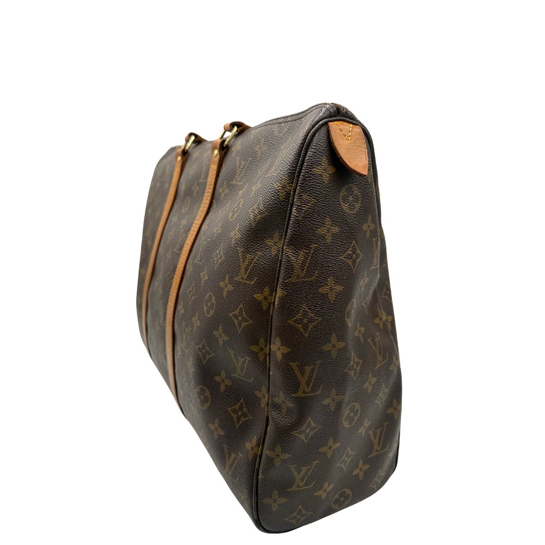lato  Borsa Louis Vuitton in canvas marrone monogram con finiture in vacchetta naturale e parti metalliche dorate; munita di doppi manici, indossabile a spalla. Completa di dustbag, di lusso, originale, ottime condizioni, usata. 