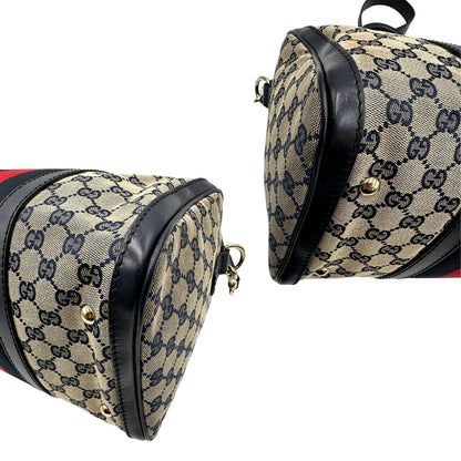 angoli  Borsa Gucci in tessuto blu GG con finiture in pelle tono su tono, parti metalliche dorate e striscia Web blu e rossa; munita di doppi manici stondati e una tracolla amovibile e regolabile. Completa di dustbag, di lusso, originale, ottime condizioni, usata. 