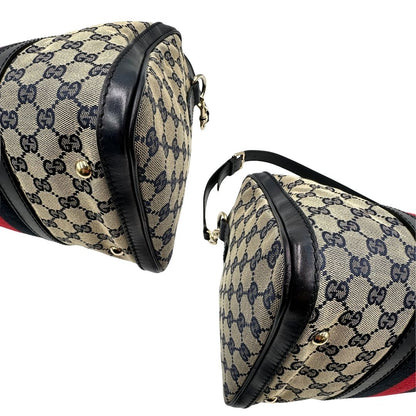 angoli  Borsa Gucci in tessuto blu GG con finiture in pelle tono su tono, parti metalliche dorate e striscia Web blu e rossa; munita di doppi manici stondati e una tracolla amovibile e regolabile. Completa di dustbag, di lusso, originale, ottime condizioni, usata. 