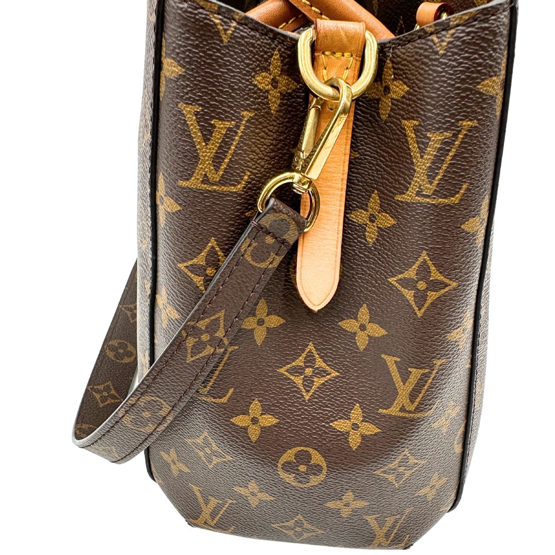lato  Borsa Louis Vuitton in canvas marrone monogram con finiture in vacchetta naturale e parti metalliche dorate; munita di doppi manici stondati, e una tracolla amovibile, di lusso, originale, ottime condizioni, usata. 