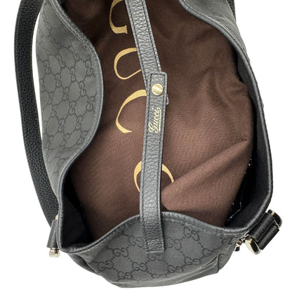 interno della  Borsa Gucci in tessuto nero GG con finiture in pelle tono su tono e parti metalliche dorate; munita di doppi manici, indossabile a spalla. Completa di dustbag, di lusso, originale, ottime condizioni, usata. 