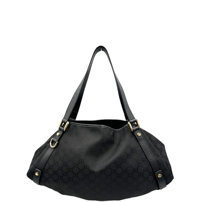 front  Borsa Gucci in tessuto nero GG con finiture in pelle tono su tono e parti metalliche dorate; munita di doppi manici, indossabile a spalla. Completa di dustbag, di lusso, originale, ottime condizioni, usata. 