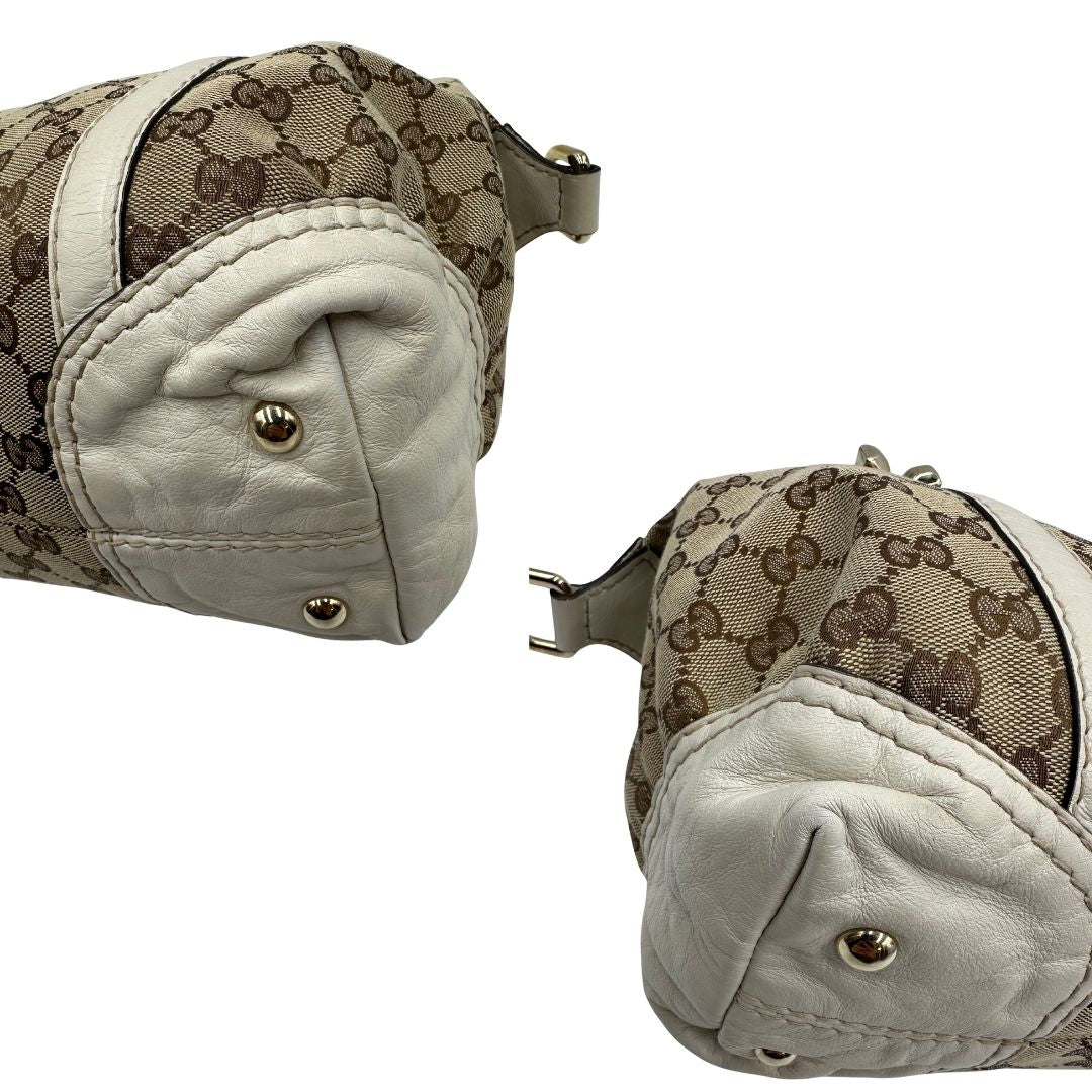 angoli  Borsa Gucci in tessuto GG beige con finiture in pelle color avorio e parti metalliche; munita di doppi manici stondati, da portare a mano. Completa di dustbag, di lusso, originale, ottime condizioni, usato. 