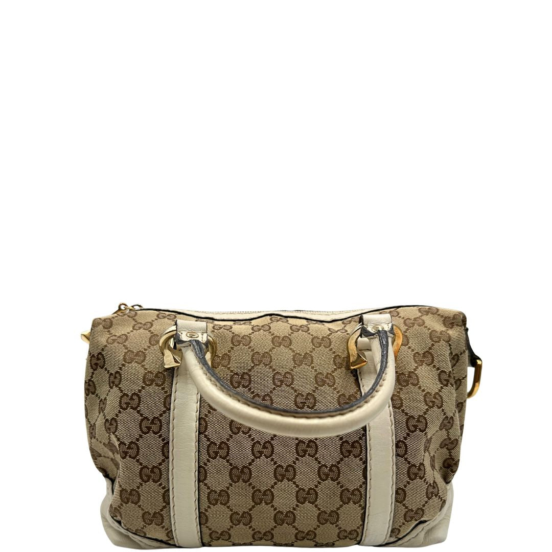 retro  Borsa Gucci in tessuto GG beige con finiture in pelle color avorio e parti metalliche; munita di doppi manici stondati, da portare a mano. Completa di dustbag, di lusso, originale, ottime condizioni, usato.