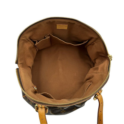 interno  Borsa Louis Vuitton in canvas marrone monogram con finiture in vacchetta naturale e parti metalliche dorate; munita di doppi manici regolabile, da portare a mano o a spalla. Dotata di dustbag, di lusso, originale, ottime condizioni, usata. 