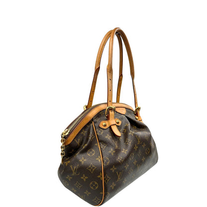 lato  Borsa Louis Vuitton in canvas marrone monogram con finiture in vacchetta naturale e parti metalliche dorate; munita di doppi manici regolabile, da portare a mano o a spalla. Dotata di dustbag, di lusso, originale, ottime condizioni, usata. 