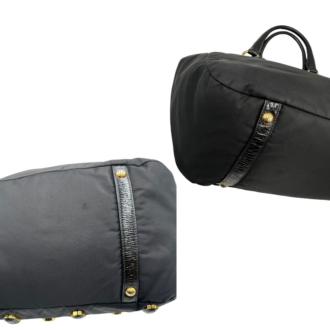 angoli  Borsa Prada in nylon nero con parti metalliche dorate e manici in pelle lucida; impreziosita da pietre su tutta la superficie del front; munita di doppi manici stondati, di lusso, originale, ottime condizioni, usata. 