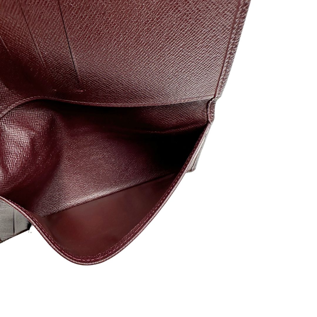 interno  Portafoglio Louis Vuitton in pelle bordeaux. Completo di dustbag, di lusso, originale, ottime condizioni, usato. 