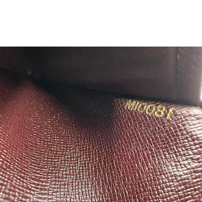 interno  Portafoglio Louis Vuitton in pelle bordeaux. Completo di dustbag, di lusso, originale, ottime condizioni, usato. 