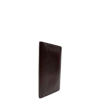 lato  Portafoglio Louis Vuitton in pelle bordeaux. Completo di dustbag, di lusso, originale, ottime condizioni, usato. 