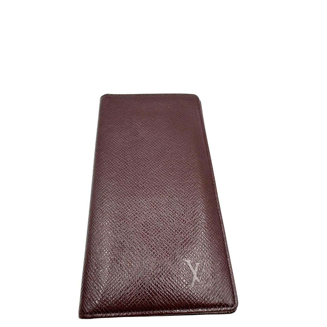 front  Portafoglio Louis Vuitton in pelle bordeaux. Completo di dustbag, di lusso, originale, ottime condizioni, usato. 