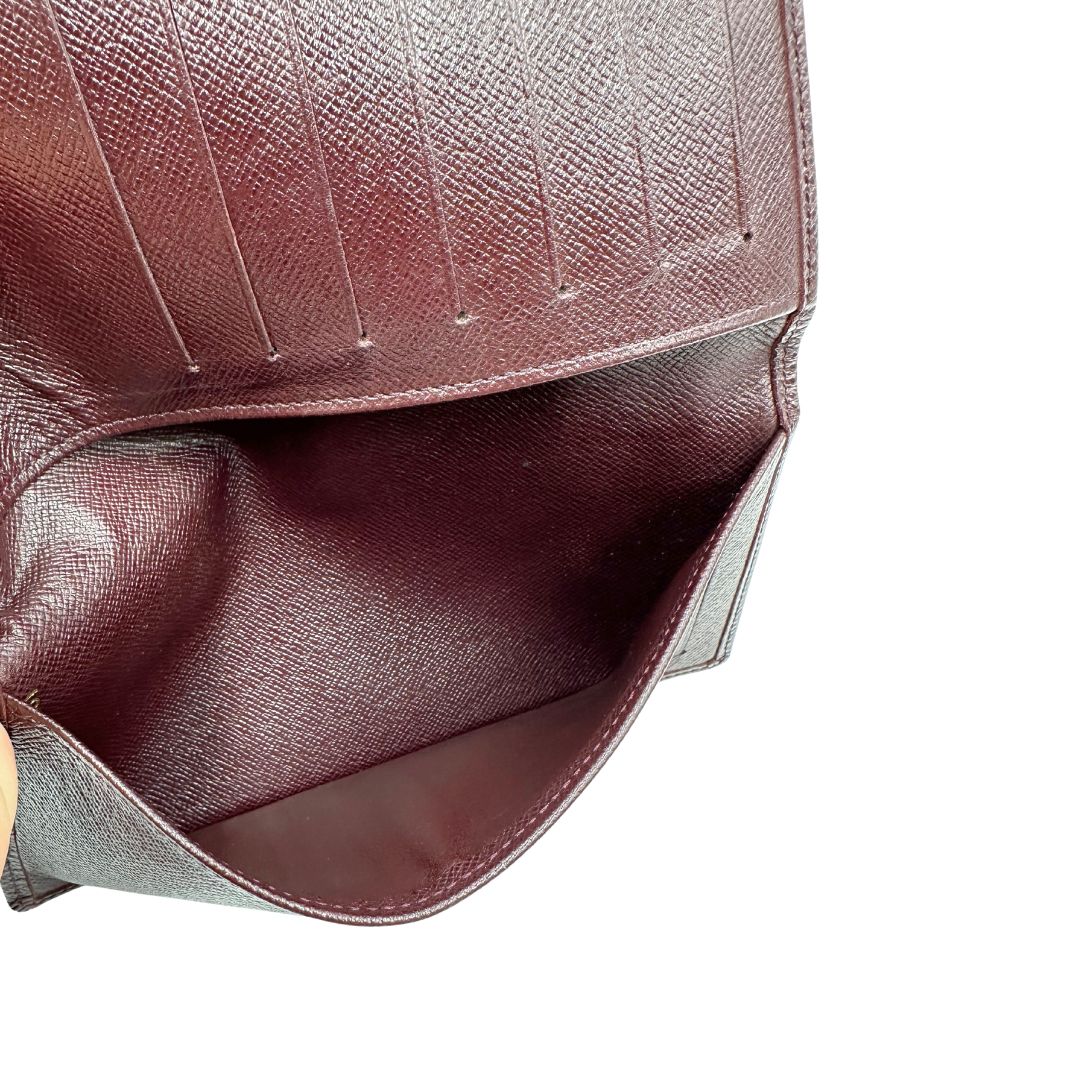 interno  Portafoglio Louis Vuitton in pelle bordeaux. Completo di dustbag, di lusso, originale, ottime condizioni, usato. 