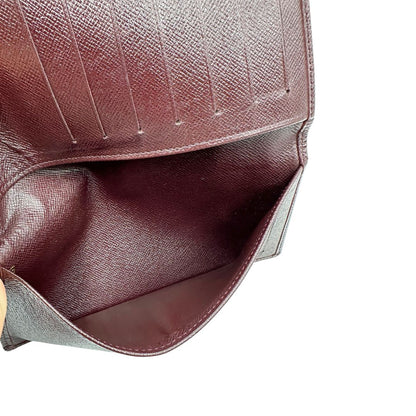 interno  Portafoglio Louis Vuitton in pelle bordeaux. Completo di dustbag, di lusso, originale, ottime condizioni, usato. 