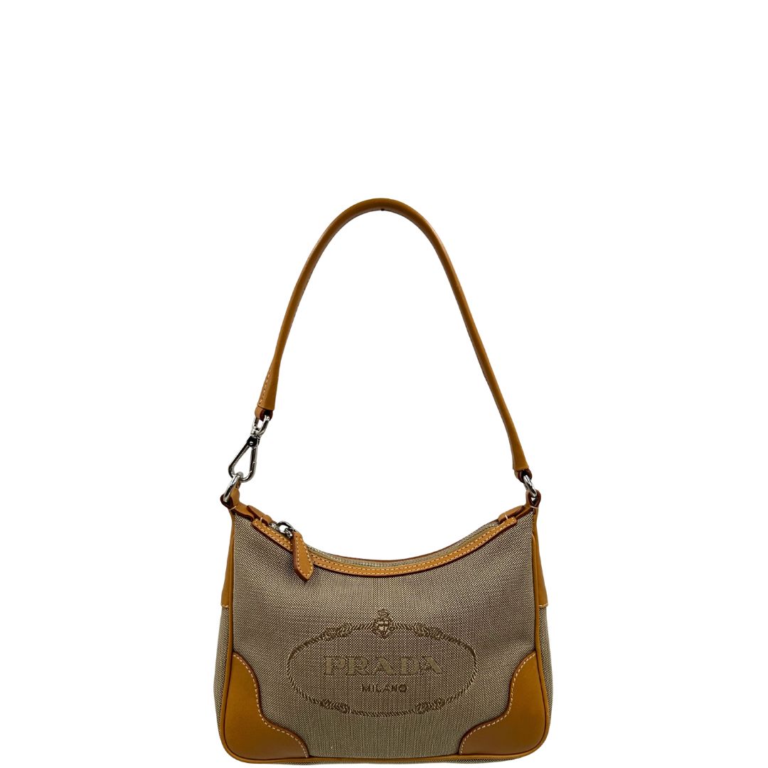 front Borsa Prada in tessuto color corda con finiture in pelle marroni e parti metalliche argentate; munita di un manico singolo, di lusso, originale, ottime condizioni. 