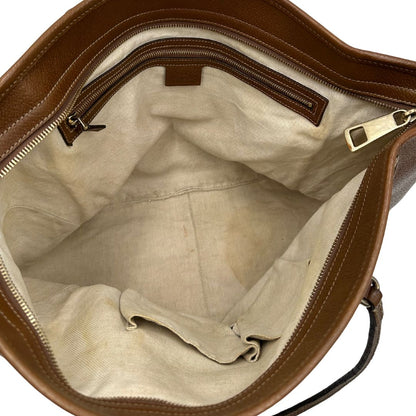 interno Borsa Gucci in tessuto GG con finiture in pelle marroni e parti metalliche dorate; munita di doppi manici, indossabile a spalla. Completa di dustbag, di lusso, buone condizioni,usata. 