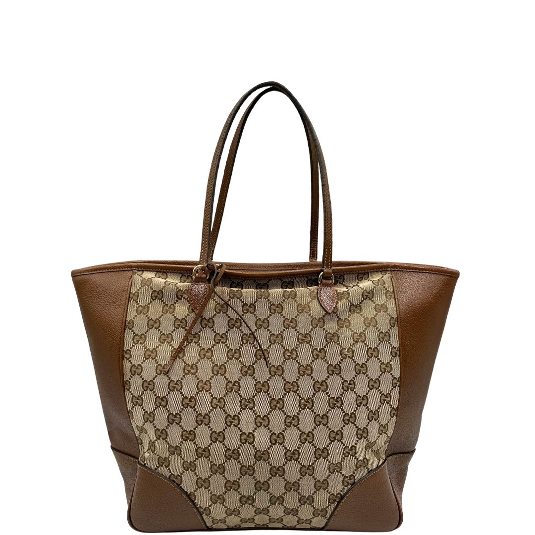 front Borsa Gucci in tessuto GG con finiture in pelle marroni e parti metalliche dorate; munita di doppi manici, indossabile a spalla. Completa di dustbag, di lusso, buone condizioni,usata. 
