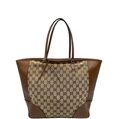 front Borsa Gucci in tessuto GG con finiture in pelle marroni e parti metalliche dorate; munita di doppi manici, indossabile a spalla. Completa di dustbag, di lusso, buone condizioni,usata. 