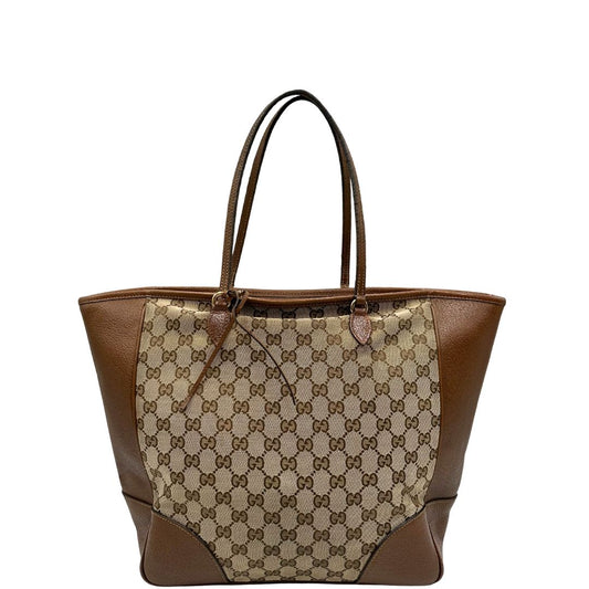 front Borsa Gucci in tessuto GG con finiture in pelle marroni e parti metalliche dorate; munita di doppi manici, indossabile a spalla. Completa di dustbag, di lusso, buone condizioni,usata. 