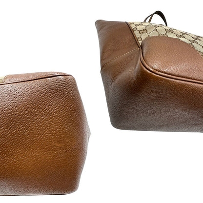 Borsa Gucci in tessuto GG con finiture in pelle marroni e parti metalliche dorate; munita di doppi manici, indossabile a spalla. Completa di dustbag, di lusso, buone condizioni,usata.