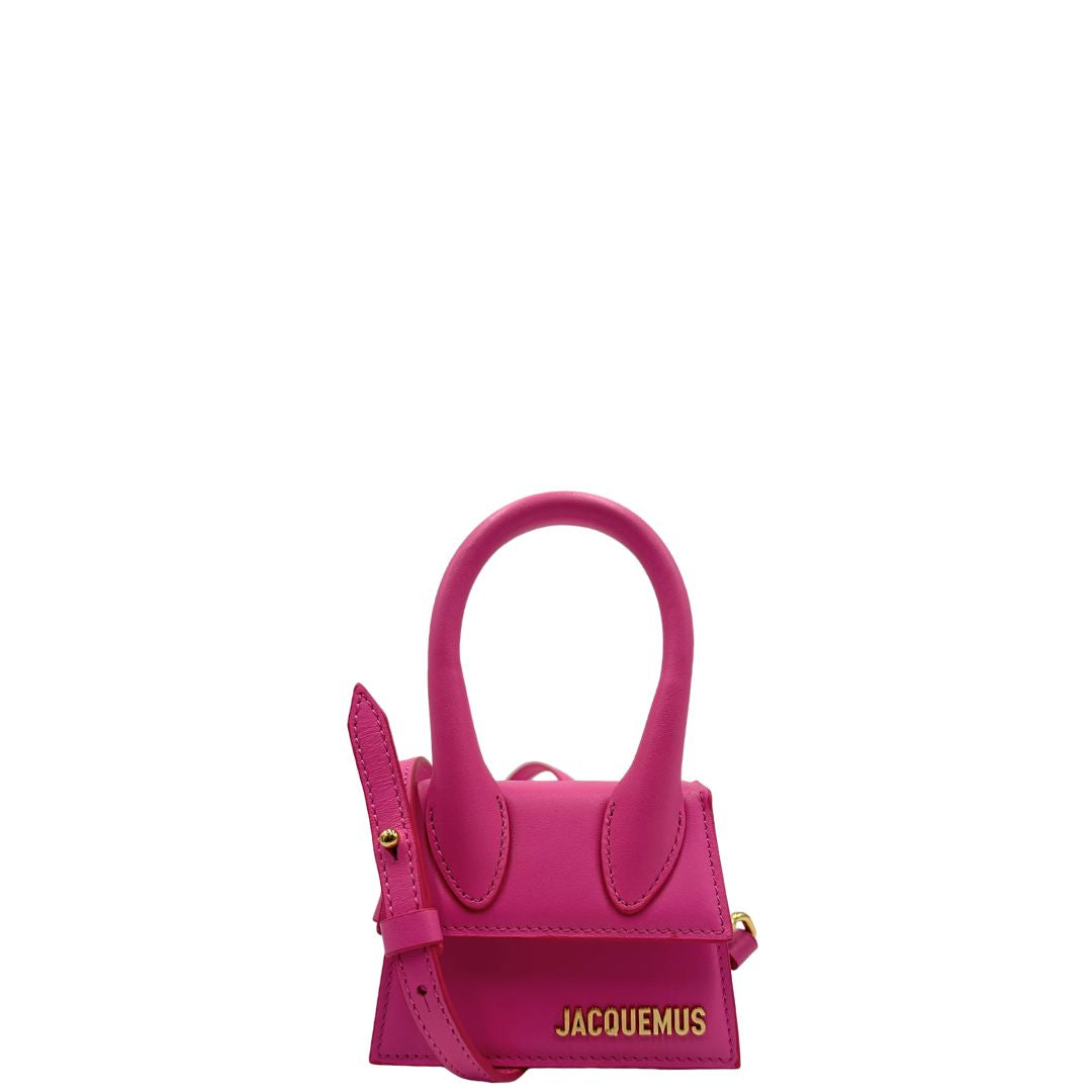 front Borsa Le Chiquito mini Jacquemus in pelle rosa con parti metalliche dorate, munita di un manico stondato e una tracolla amovibile e regolabile. Indossabile a mano oppure a tracolla. Originale, usata, di lusso, in ottime condizioni. 