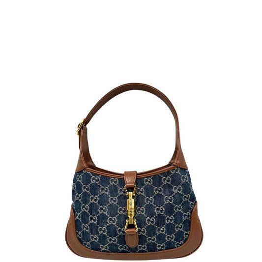 front  Borsa Gucci in tessuto blu GG denim, finiture in pelle marrone e parti metalliche dorate; munita di un manico singolo allungabile, indossabile a spalla o a tracolla, di lusso, originale, ottime condizioni, usata. 
