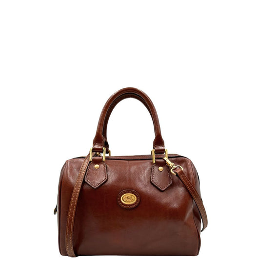 front  Bauletto The Bridge in cuoio con parti metalliche dorate; munita di una tracolla amovibile e doppi manici stondati. Completa di dustbag, di lusso, originale, ottime condizioni, usata. 