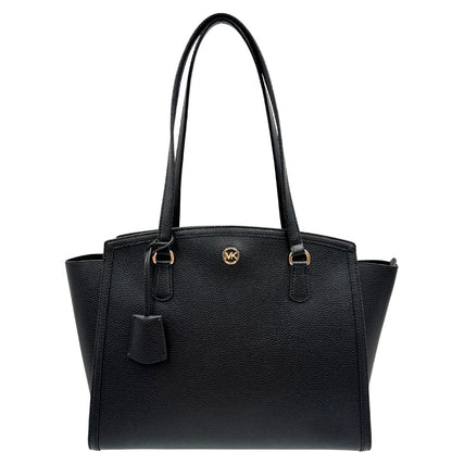 front  Borsa MK in pelle martellata nera con parti metalliche dorate; munita di doppi manici, indossabile a spalla, di lusso, originale, ottime condizioni, usata. 