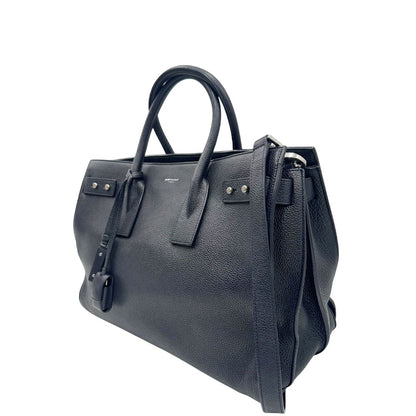 lato  Borsa Saint Laurent in pelle martellata blu con parti metalliche argentate; munita di doppi manici stondati e una tracolla amovibile e regolabile, di lusso, originale, ottime condizioni, usata, originale. 