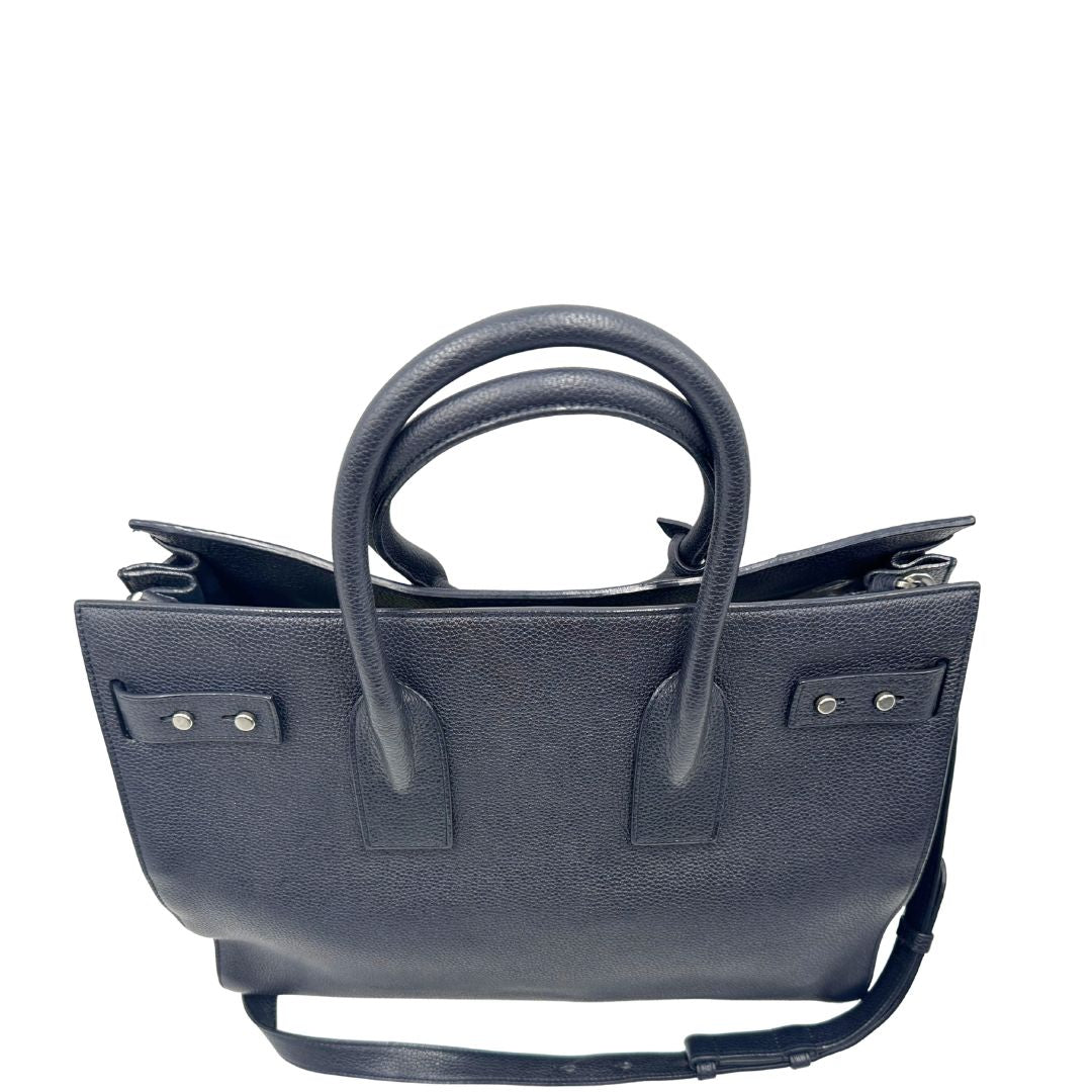 manici  Borsa Saint Laurent in pelle martellata blu con parti metalliche argentate; munita di doppi manici stondati e una tracolla amovibile e regolabile, di lusso, originale, ottime condizioni, usata, originale. 