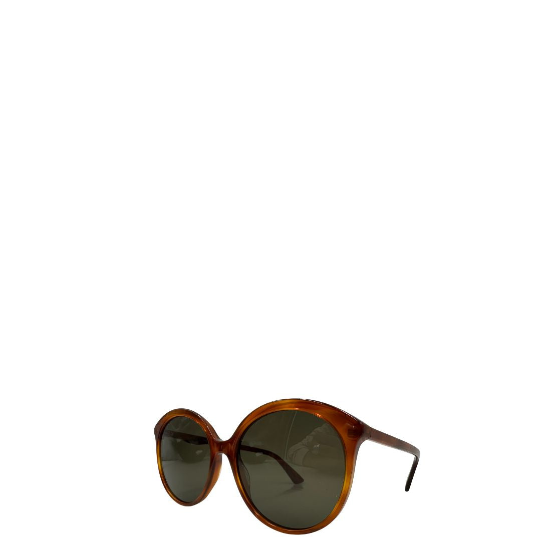 lato Occhiali Gucci caratterizzati da un design oversize, di lusso, originale, ottime condizioni, usati. 