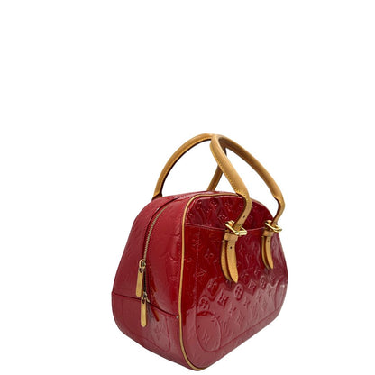 lato  Borsa Louis Vuitton realizzata in pelle monogram verniciata e dettagli in vacchetta naturale, di lusso, originale, ottime condizioni, usata. 