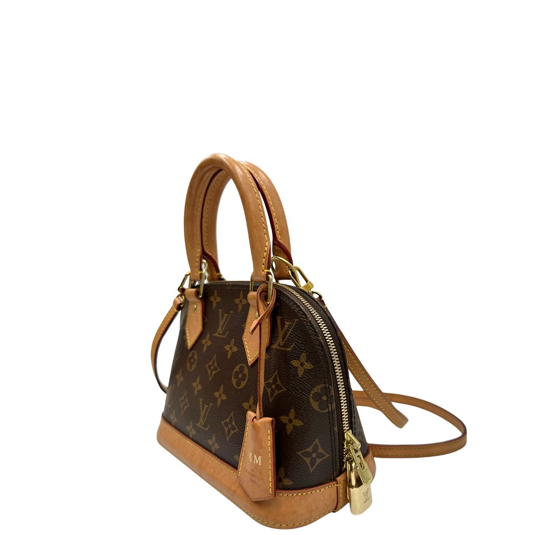 lato  Louis Vuitton Alma in tela monogram nella versione BB, di lusso, originale, ottime condizioni, usata. 