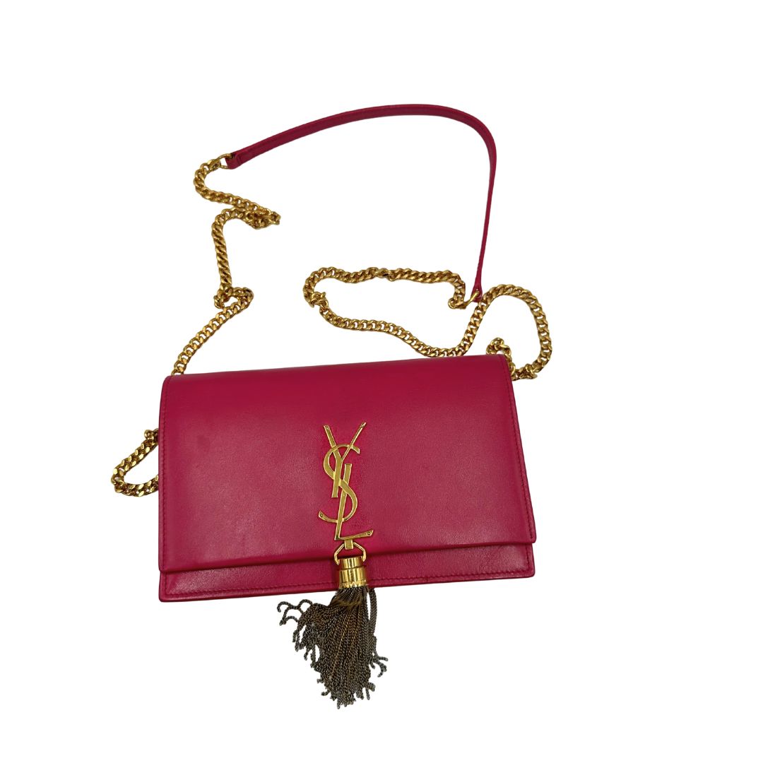 Borsa Kate di Saint Laurent in pelle fucsia, nella versione compatta wallet. Originale, usata, di lusso, in condizioni buone.