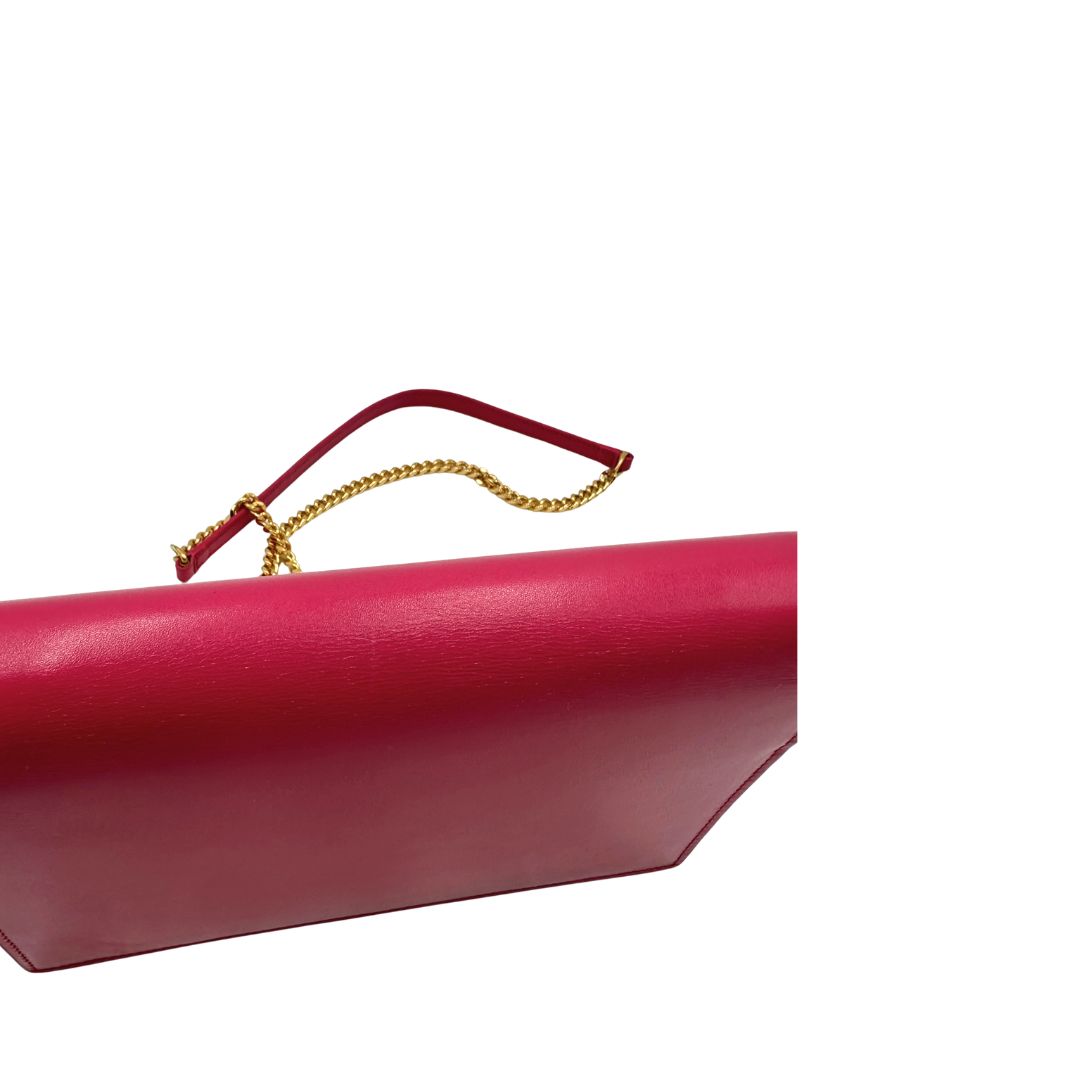 Borsa Kate di Saint Laurent in pelle fucsia, nella versione compatta wallet. Originale, usata, di lusso, in condizioni buone.