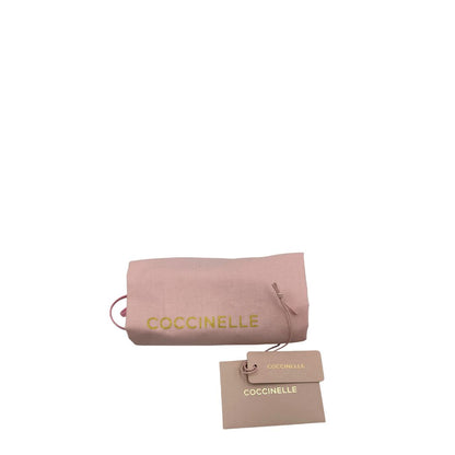 Dustbag, cartellino, Borsa Coccinelle ;design bicolore che unisce materiali naturali e pelle.