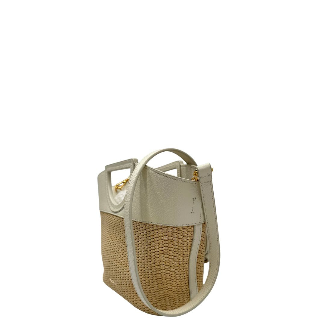 Lato sinistro, Borsa Coccinelle ;design bicolore che unisce materiali naturali e pelle.