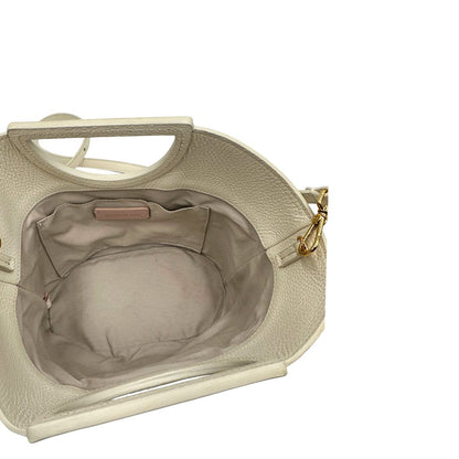 Interno, Borsa Coccinelle ;design bicolore che unisce materiali naturali e pelle.