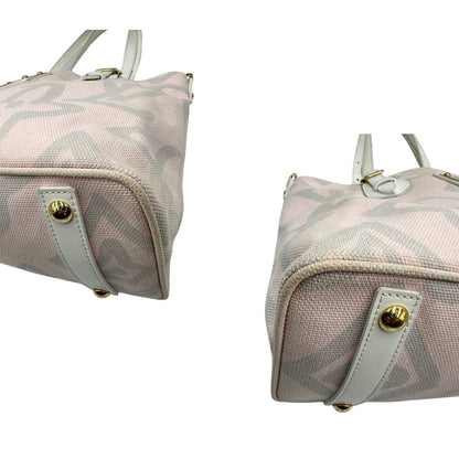 Angoli, Borsa Louis Vuitton in tela resistente bicolore con motivi floreali coordinati.